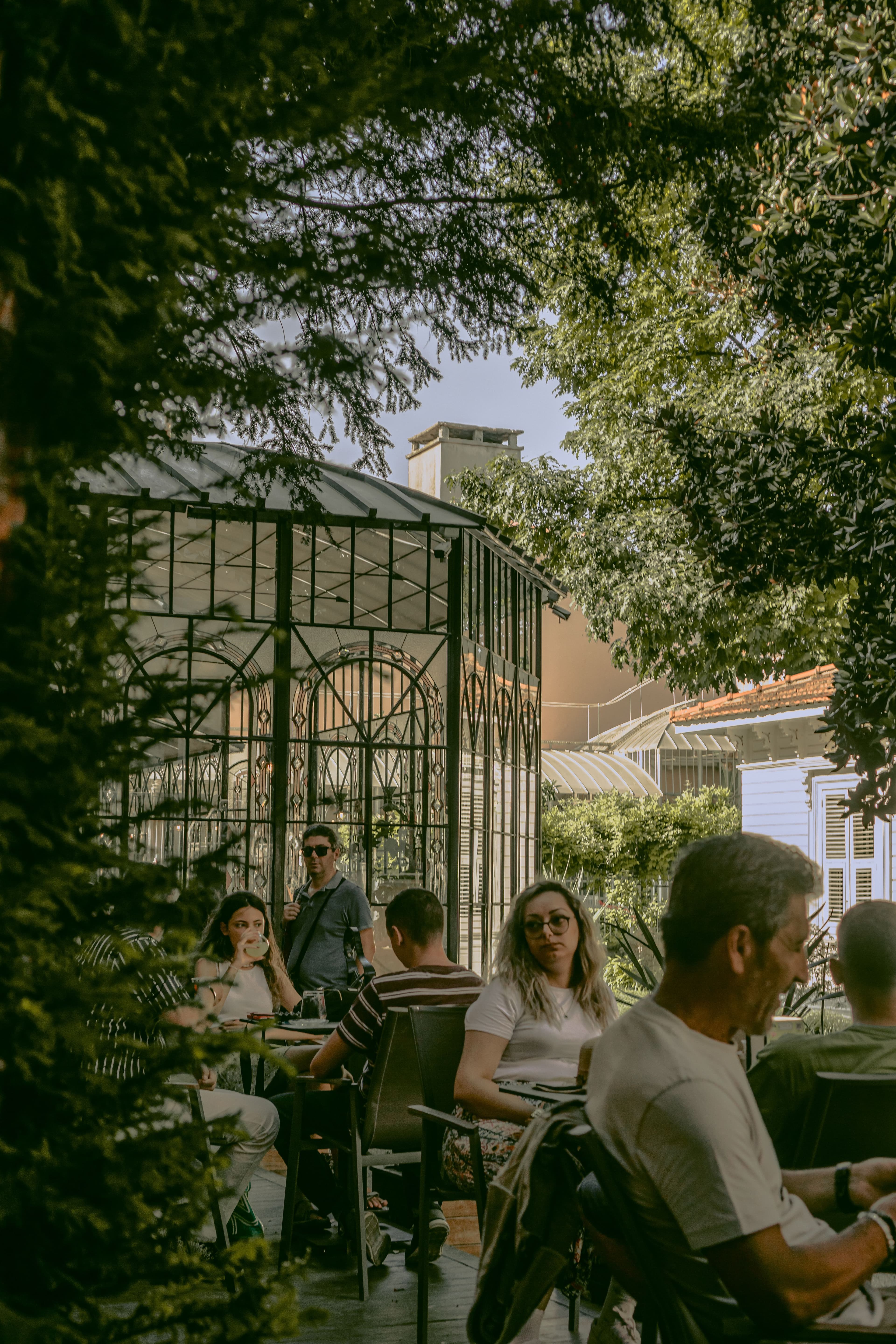 People sitting together in a garden courtyard